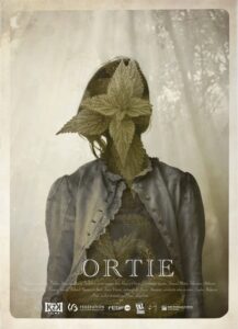 1. Female figure with leaves covering her face, urban style, artistic photography.