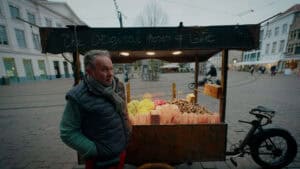 Bright street vendor selling sweets in a busy city square.