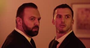 Dynamic entrepreneurs at Lift-Off Global Network event in suits, networking and sharing innovative ideas.