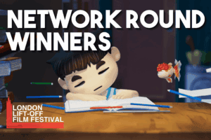 Young boy studying at desk with fish, promoting learning and education at Lift-Off Global Network event.